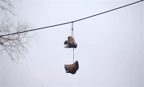 shoes hanging from wires meaning.